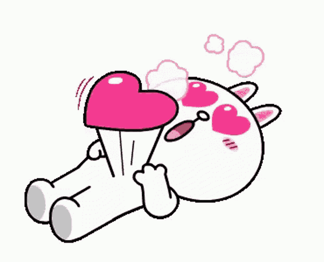 a cartoon character is laying on the floor with a heart in front of his eyes .