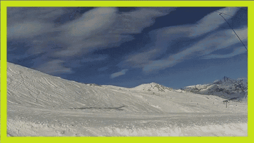 a picture of a snowy mountain with a yellow frame around it