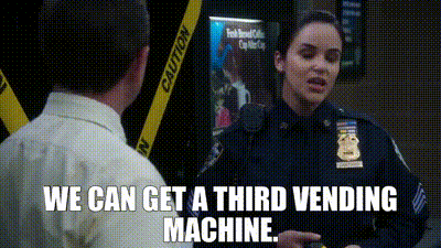 a woman in a police uniform is talking to a man in a white shirt .