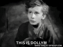 a black and white photo of a young boy with the words `` this is dolly '' written on it .
