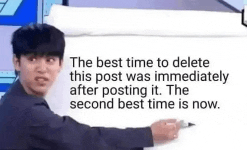 a man is standing in front of a white board with a marker and writing on it .