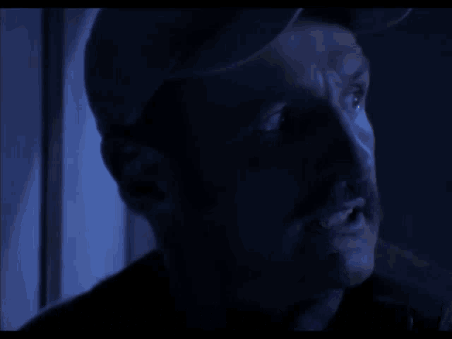 a man in a dark room with the words they came up the escape tunnel behind him