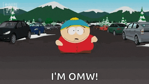 a cartoon character from south park is standing in a parking lot with cars and mountains in the background .