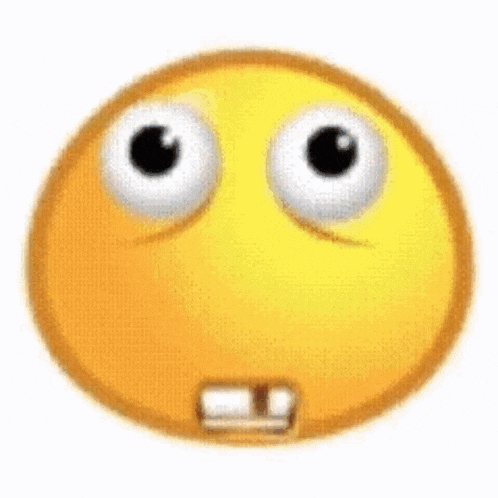 a close up of a yellow smiley face with big eyes and teeth .