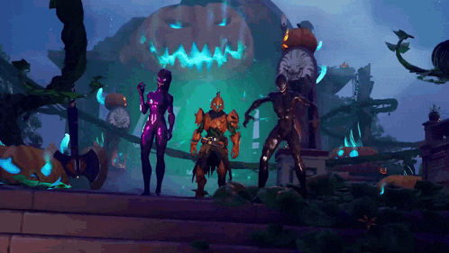 a couple of people standing in front of a pumpkin