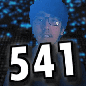 a man with glasses and the number 543 in front of his face