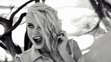 a black and white photo of a woman with blonde hair .