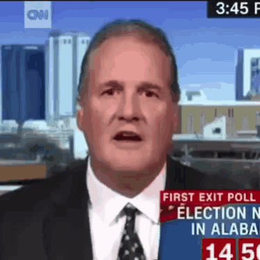 a man in a suit and tie is on cnn talking about the first exit poll election in alabama