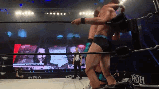 a wrestling match between dalton castle and brian storm