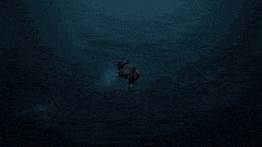 a person is flying through the air in the dark