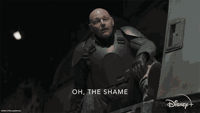 a man in armor says oh the shame in front of a disney + logo