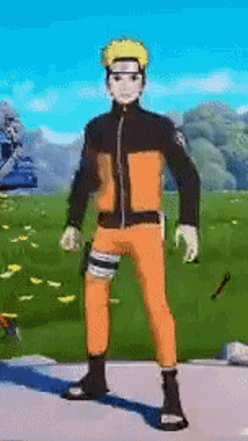 a man in a naruto costume is standing in a field holding a sword .