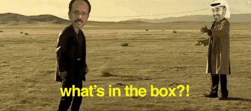two men standing in a field with the words " what 's in the box " on the bottom