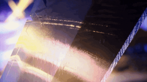 a blurred image of a person 's face with a purple background