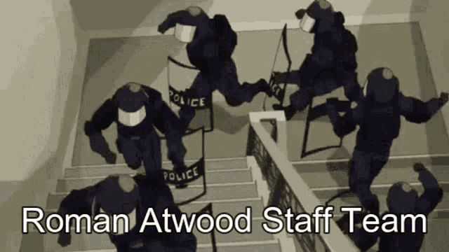 a group of police officers are running down the stairs