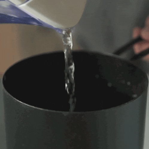 Pouring Water Into The Pot Two Plaid Aprons GIF - Pouring Water Into The Pot Two Plaid Aprons Adding Water GIFs