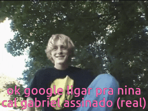 a young boy is sitting under a tree with the words ok google ligar pra nina cat gabriel assinado ( real )