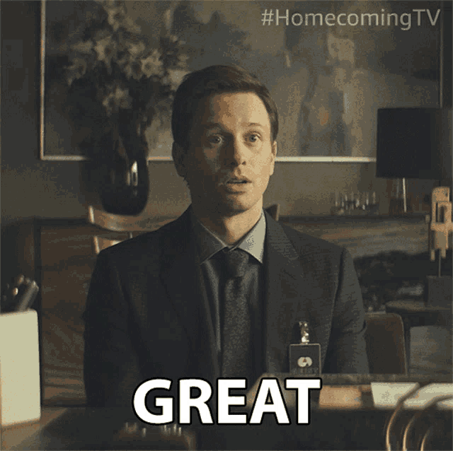 a man in a suit and tie says great in front of a #homecoming tv logo