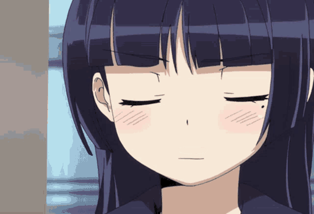 a close up of a girl 's face with her eyes closed and her blush visible