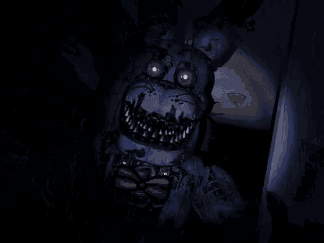 a blurry picture of a monster with purple eyes