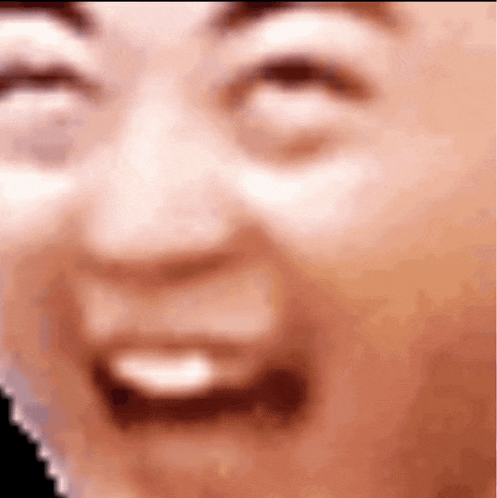 a close up of a man 's face with his eyes closed and his mouth open .