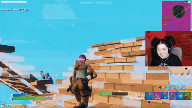 a girl is playing a video game and the screen says enemys alive 15/14