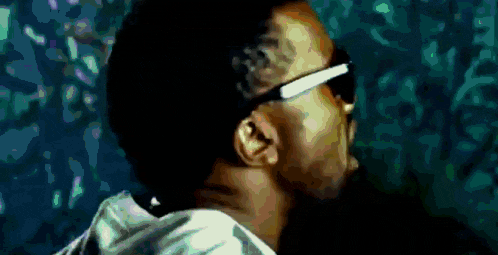 a pixelated image of a man wearing sunglasses and a hoodie