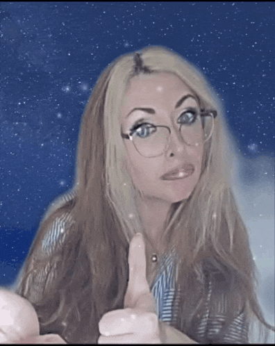 a woman with glasses giving a thumbs up sign