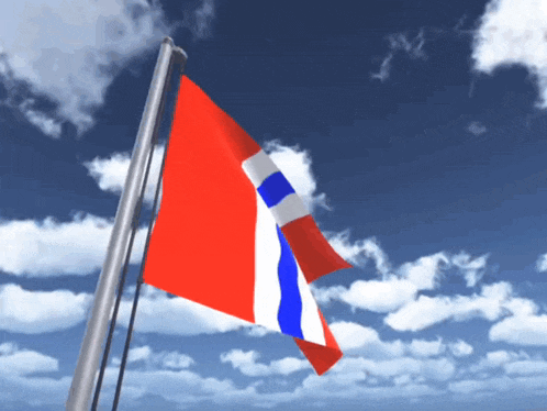 a red white and blue flag is waving in the wind against a blue sky