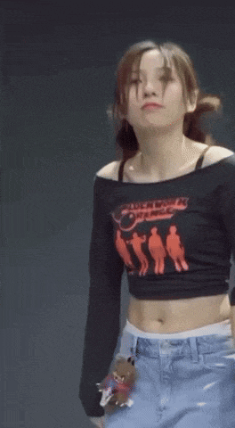 a woman wearing a black clockwork orange shirt
