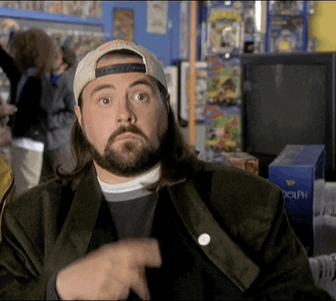 a man with long hair and a beard is wearing a hat that says dolphin