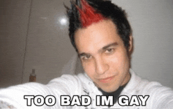 a man with red hair takes a selfie with the words too bad im gay below him