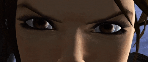a close up of a woman 's eyes with a very angry look on her face