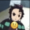 a blurry picture of a person holding a yellow smiley face .