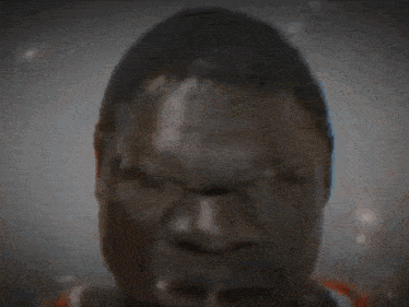 a blurry picture of a man with red eyes