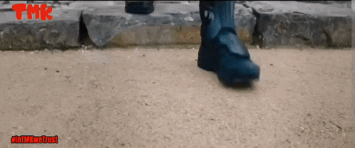 a tmk ad shows a person 's feet walking on a sidewalk