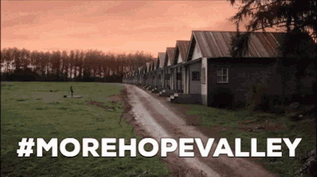 a row of houses on a dirt road with #morehopevalley written below them