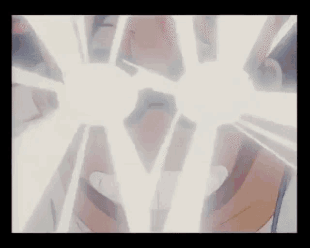 a close up of a person 's face with a glowing light coming out of it .