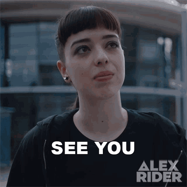 a woman in a black shirt says see you