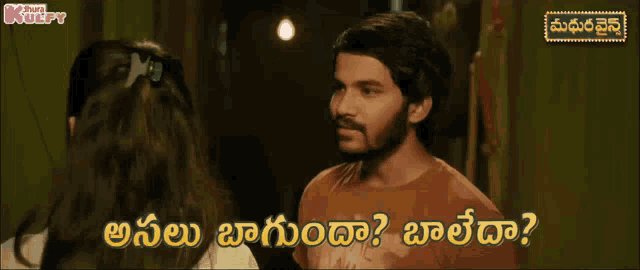 a man is talking to a woman in a foreign language and the words are in a foreign language
