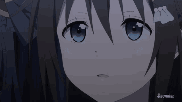 a close up of a girl with her eyes closed and the word sunrise on the bottom
