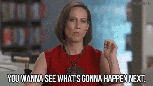 a woman in a red dress is saying you wanna see what 's gonna happen next