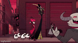 a cartoon character with horns is holding a cell phone and saying oh f * ck