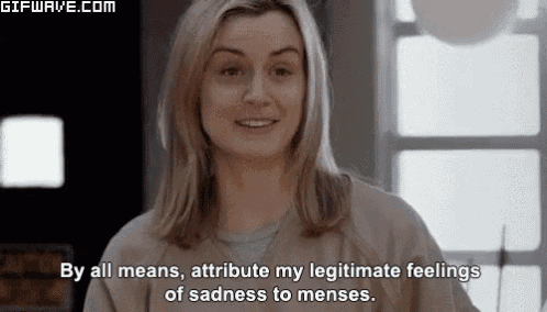 a woman is smiling and saying by all means attribute my legitimate feelings of sadness to menses