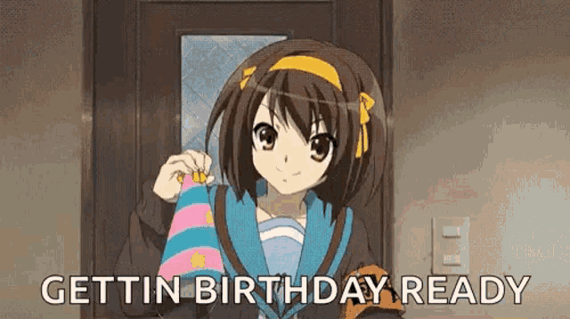 a girl from an anime is holding a birthday hat in front of a door and says `` gettin birthday ready '' .