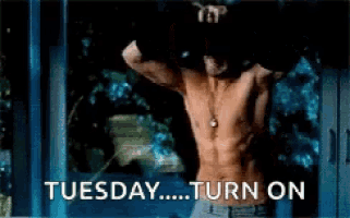 a shirtless man is standing in front of a window with the words tuesday turn on written below him