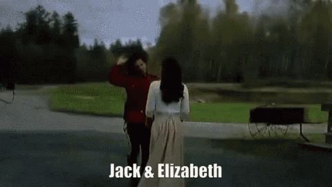 a man and a woman are standing next to each other in a park with the words jack and elizabeth on the bottom .