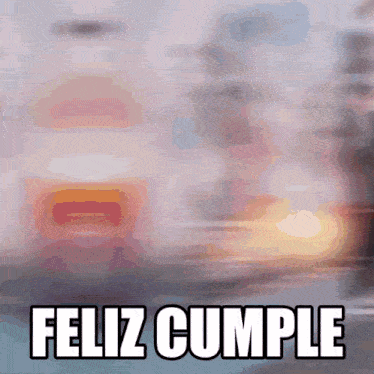 a blurred image with the words feliz cumple in white letters