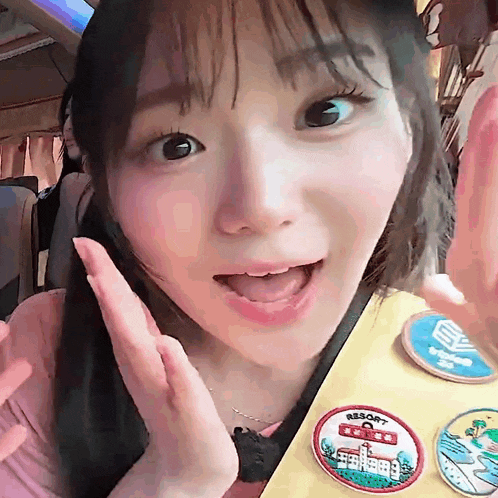a girl is wearing a badge that says resort