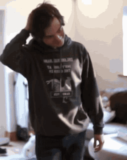a man wearing a hoodie that says ' i 'm a ninja ' on it
